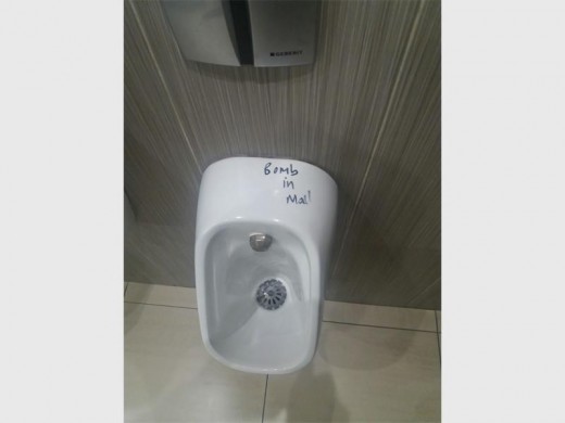 The second hoax bomb scare was written on a urinal.