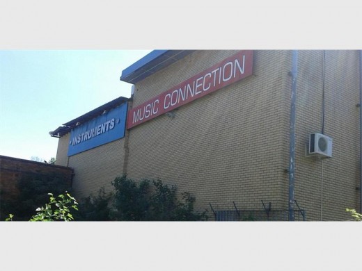 Vacant land adjacent to Music Connection has become a dumping site and the store says it is not responsible.