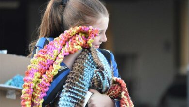 St Teresa's Senior School Grade 5 learner Hannah von Flemming has all these warm scarves to give away. Photo: Supplied