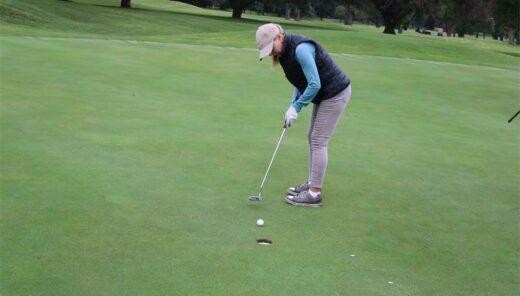 Joan Gaddie aims for the hole.