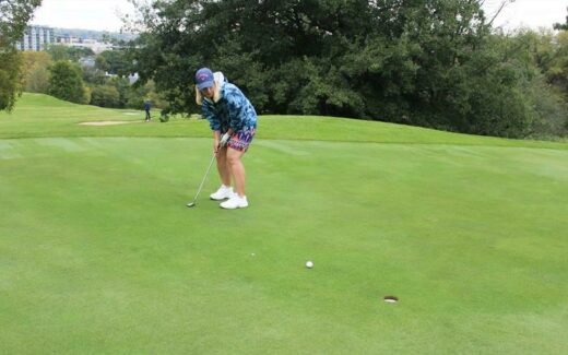 Megan Masson keeps her eye on the golf ball.