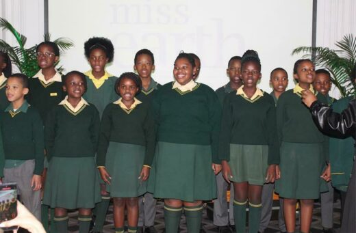 Mondeor Primary School learners sing the national anthem at the 20th anniversary of Miss Earth.