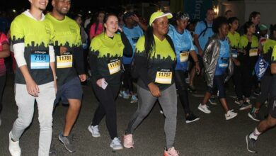 Participants run and walk to represent their companies