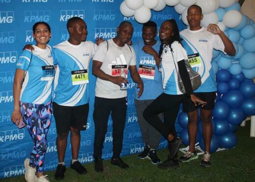 The KPMG team plays its part towards a run