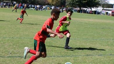 Old Edwardians U12 player Caleb Watts runs with the ball. Photo: Asanda Matlhare