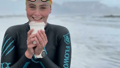 Sienna Blaauw has a warm drink after her long cold swim.