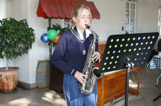 Angela Naude plays the saxophone for the residents at Park Care. Photo: Asanda Matlhare