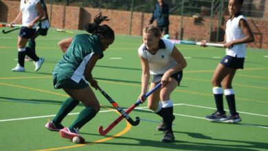 Brescia House School U13 player, Kutlwano Moloto and St Teresa's School U13 player, Katelyn Kruger battle it out for the hockey ball. Photo: Asanda Matlhare