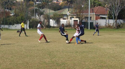 The two teams square off as they both have their feet on the ball. Photo: Naidine Sibanda