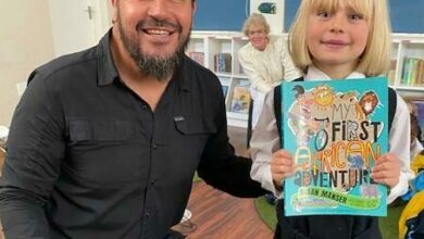 Author Riaan Manser smiles with Zoey-Rae Saffy.