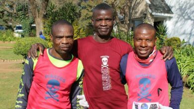 Jack Makganyoha, Mbongisani Moyo and Raudzingana Mabuda catch their breath after their 10km run. Photo: Asanda Matlhare