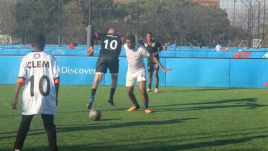 A Bernard Parker Stars (black) player and an Itec Tiyende player find themselves in a tight spot with the ball. Photo: Naidine Sibanda