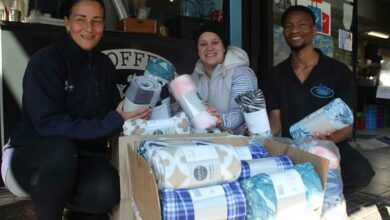 Lee Romalho from Dogs Trust with Tzipporah Berman and Mthuli Nkomo, Front of House at Tiberius Fish Emporium are happy to be part of the Winter Animal Blanket Drive. Photo: Naidine Sibanda