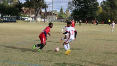 Highlands Park player Jemea Tembi (red) takes on a Warriors defender. Photo: Asanda Matlhare