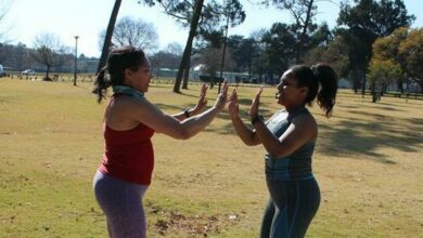 Allyson and Tyler McKenna face each other as they exercise. Photo: Asanda Matlhare
