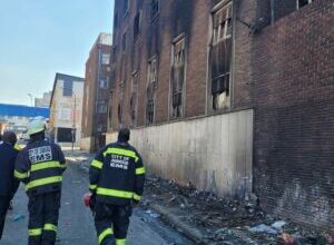 Firefighters outside the building on Alberts Street in Marshalltown. Photo: Joburg EMS.