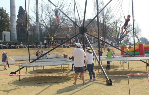 Some fanatics take on the bungee trampolines. Photo: Naidine Sibanda