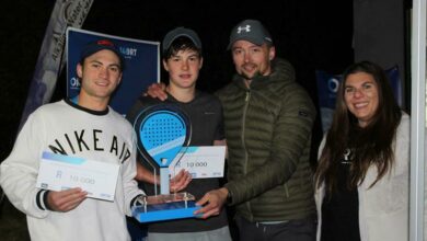 Dylan Jacobson and Chris Milton receive their prizes.
