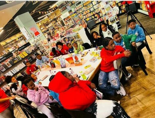 25 enthusiastic readers join in the R Book Hire book club meeting.