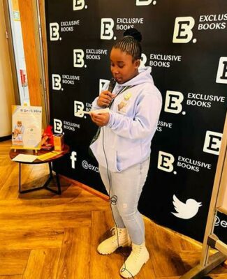 Naledi Monethi shares her book review at the book club meeting.