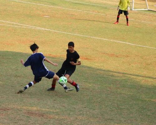 Parktown Boys U14 player Yazeed Farrath dribbles past Kayden Tien. Photo: Asanda Matlhare