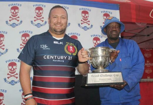 Sheldon Terblanche holds the Pirates Grand Challenge Trophy with Innocent Mbau. Photo: Naidine Sibanda