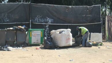 A waste picker sorts out his waste bag at the WastePreneurs centre in Greenside. Photo: Naidine Sibanda