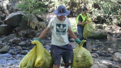 Tons of refuse bags are filed up with litter collected from the Spruit River by Dylan Busa and Ruth Kruger. Photo: Naidine Sibanda