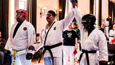 Tlhologelo Mashiane (right) wins his gold in combat weapons sparring.