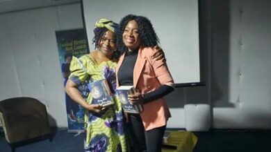 Author Victorine Mbong Shu and Dorcas Gwenhure of the Stacey Fru Foundation show off their book copies.
