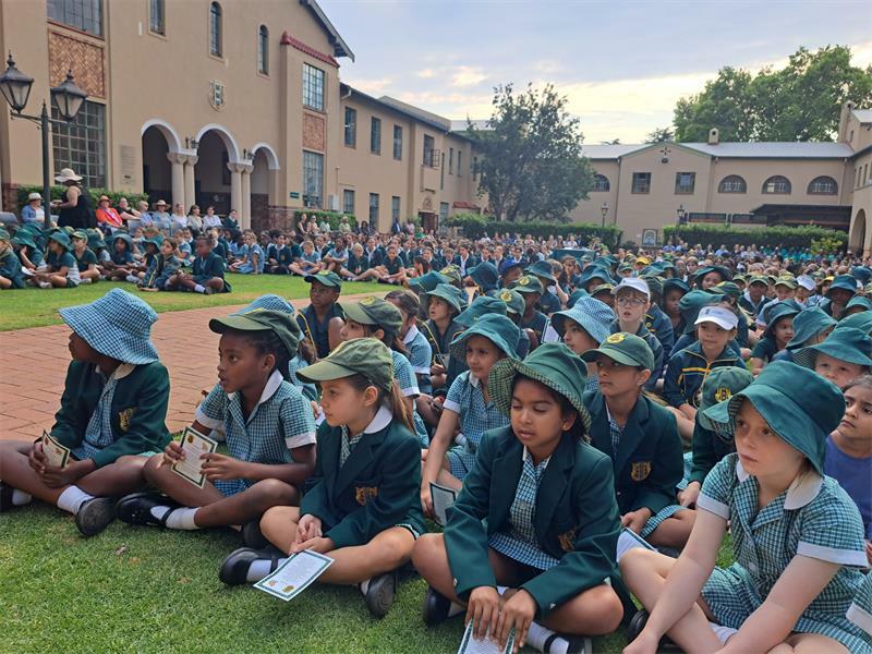 A birthday celebration assembly has everyone in high spirits.