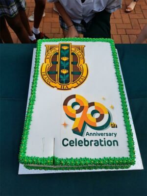 A cake designed for the occasion is shared with the whole school.