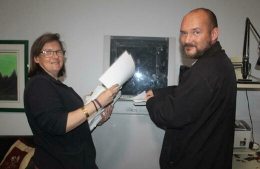 Nadine Viljoen and Dustan van Eyk put the paper onto the shredding machine. Photo: Naidine Sibanda