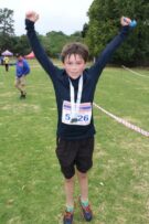 10-year-old Aiden du Toit finishes the 5km race in 00:21:00.