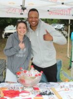 Rosebank Killarney Gazette partners with Rockies: editor Ashtyn Mackenzie and sales representative Sibusiso Khoza brave the cold to welcome the runners.