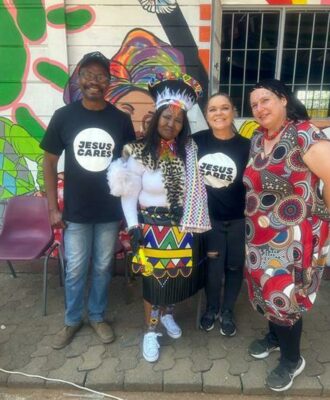 Pastor Henri Otou from Redemption Church, Mam'Maureen Shezi from Siphesihle Community Club, Natasha Collings from Redemption and Ylla Sentzikas from Siphesihle come together for Heritage Day celebrations.