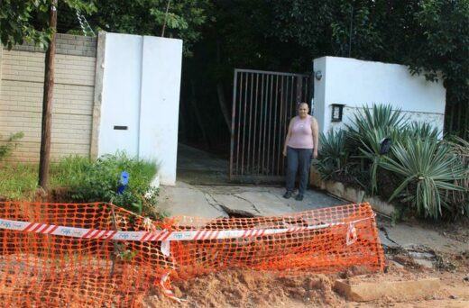 Yolanda Armoogam stands in her dug-up driveway. Photo: Asanda Matlhare
