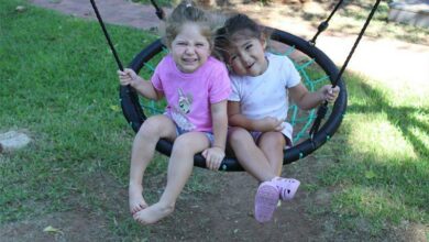 Isabella Kourie and Gianna Kourie swing the morning away.