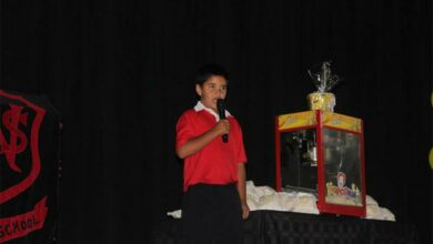 Devon Dafel recites a poem for parents for the ring-the-bell ceremony. Photo: Asanda Matlhare
