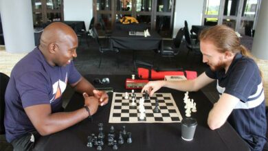 Moloko Tladi studies the board while William Cawthorn makes his move. Photo: Asanda Matlhare