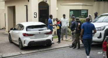 Members of the South African Police Services (SAPS) and private security companies are seen outside the house of former President Nelson Mandela. Photo: Michel Bega/The Citizen