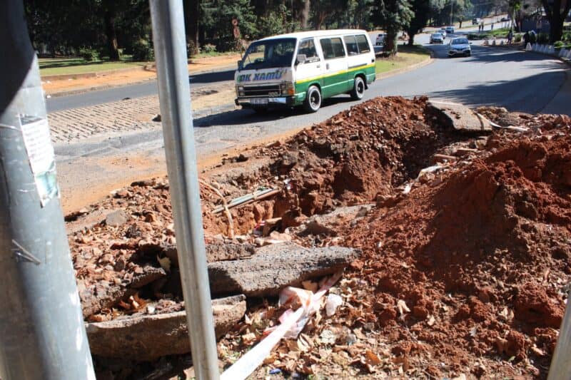 The two-year water leak on Queens Road has been stopped, but the excavation remains, and it’s a danger to motorists and pedestrians.