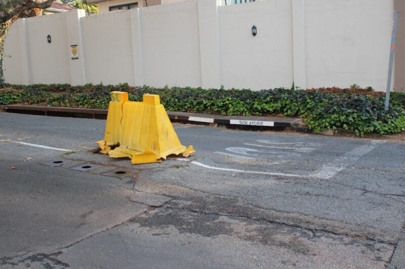 A gaping drain and crumbling road surface sparks safety fears as a councillor questions the city's response.