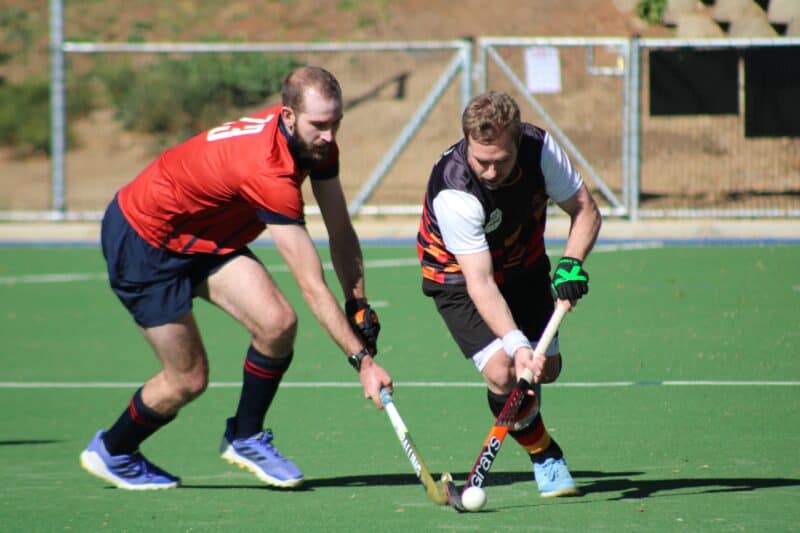 Pirates A beats Wanderers B 3–1 in a lively division 1 hockey derby played under the afternoon winter sun.