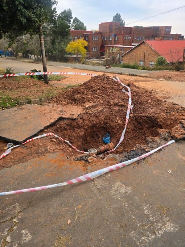 A large hole at the corner of Urania Street and Steyn Street has been left exposed, posing a risk to both motorists and pedestrians.