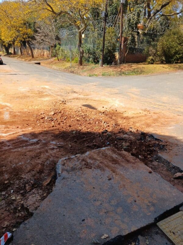 A large hole at the corner of Urania Street and Steyn Street in Observatory has been identified as the result of emergency repair work by Joburg Water.