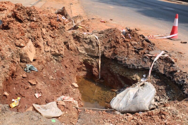 A barely barricaded excavation on Corlett Drive continues to pose a danger to motorists.
