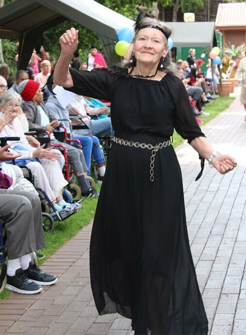 Park Care resident Christina Goodyear dances on the runway at the fashion show at Park Care on October 11, 2025. Photo: Naziya Davids-Easthorpe