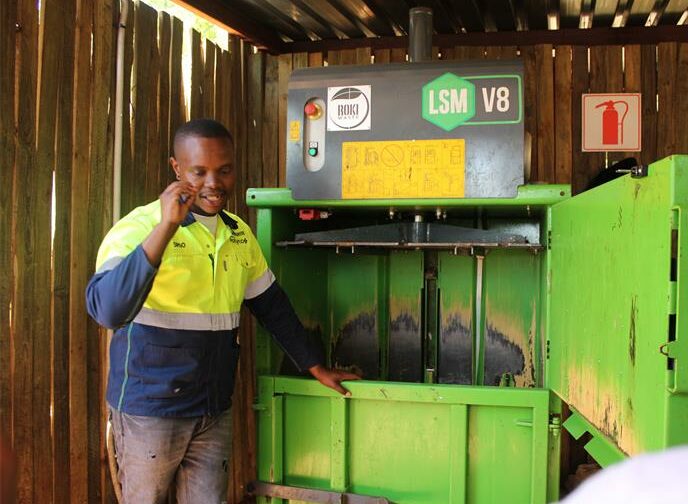 Sifiso Gumbi explains how the baling machine works in Parktown on October 25, 2025. Photo: Naziya Davids-Easthorpe