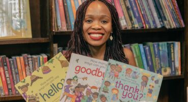 Guest Refiloe Moahloli holds new books at the H.A. Jack Library on October 23, 2025. Photo: Supplied